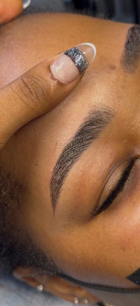 Close-up of defined nano brow arch
